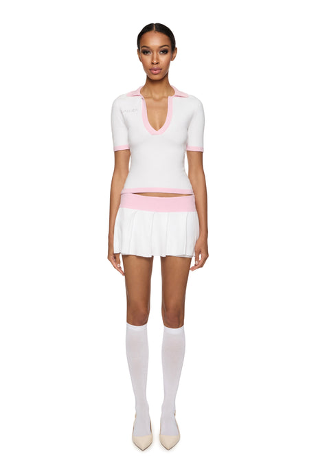 Knitted polo shirt and mini skirt