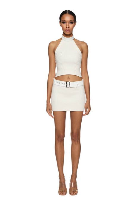 Knitted top with vegan leather chocker and mini skirt with vegan leather belt